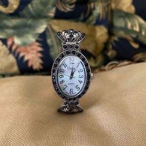 Women’s black bead decor watch.